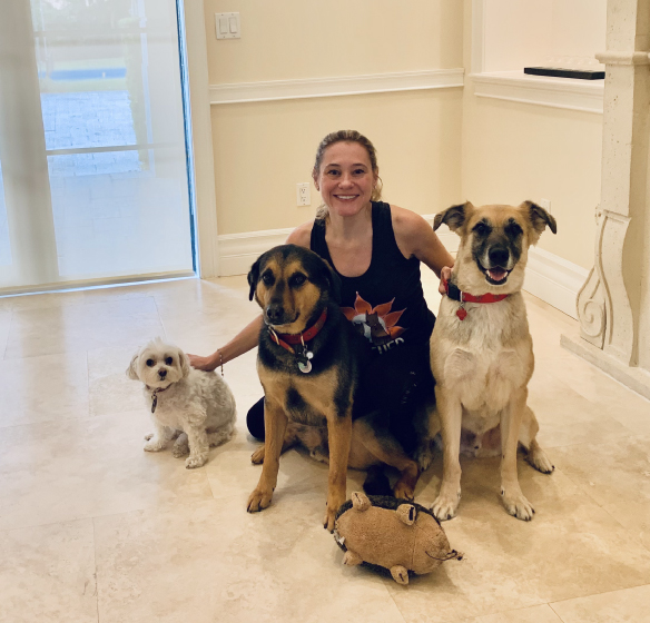 Owner of Furever Us wedding day pet care with three dogs