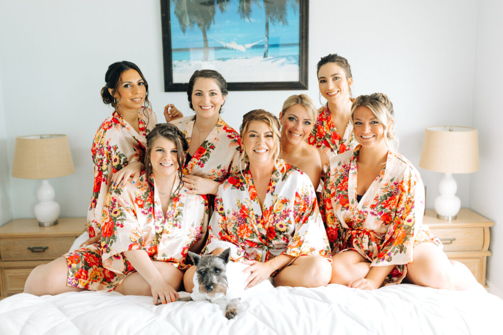 bridesmaids getting ready with the bride and the dog of honor